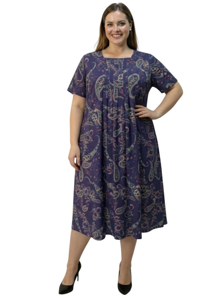 Darla Dress - Purple Print model showcasing plus size women's fashion in elegant paisley design.