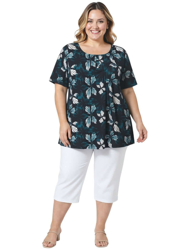 Rainer Top - Teal Print showcased on a plus size model, featuring a botanical leaf print and flowy silhouette.