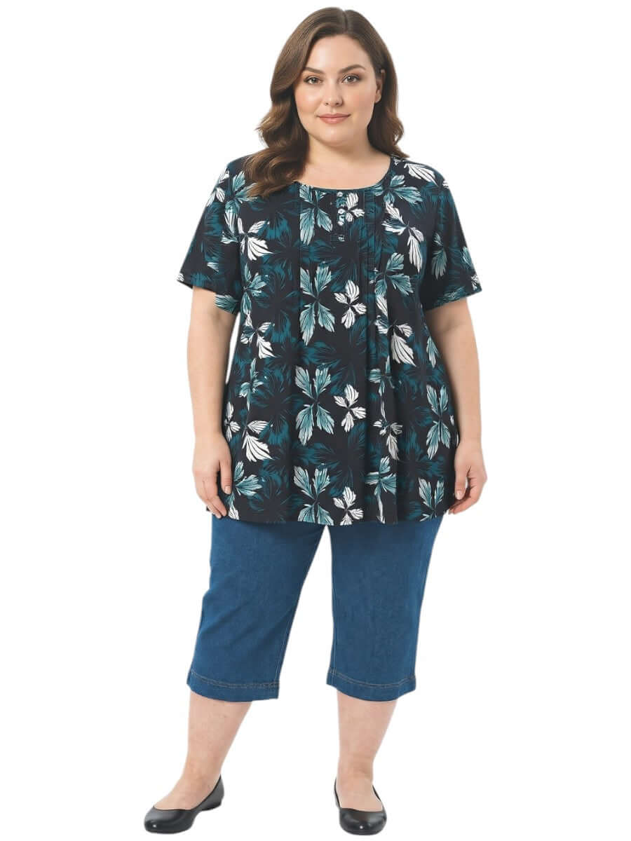 Rainer Top - Teal Print on a model, showcasing plus size women's fashion with a botanical leaf print.