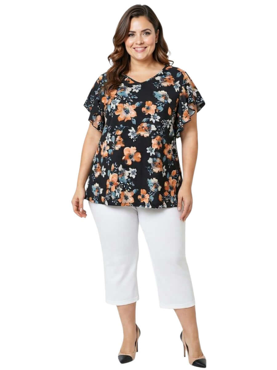 Kerissa Top - Black Print on model, showcasing vibrant floral design and flattering plus size fit for women fashion.