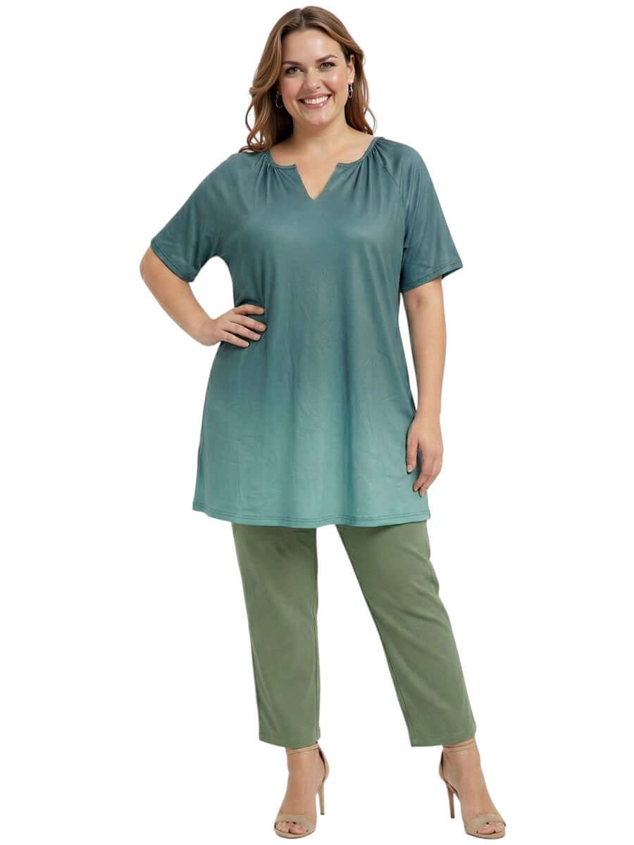 Icelynn Tunic - Teal Ombre worn by a model, featuring a gradient from teal to seafoam green, paired with olive pants.