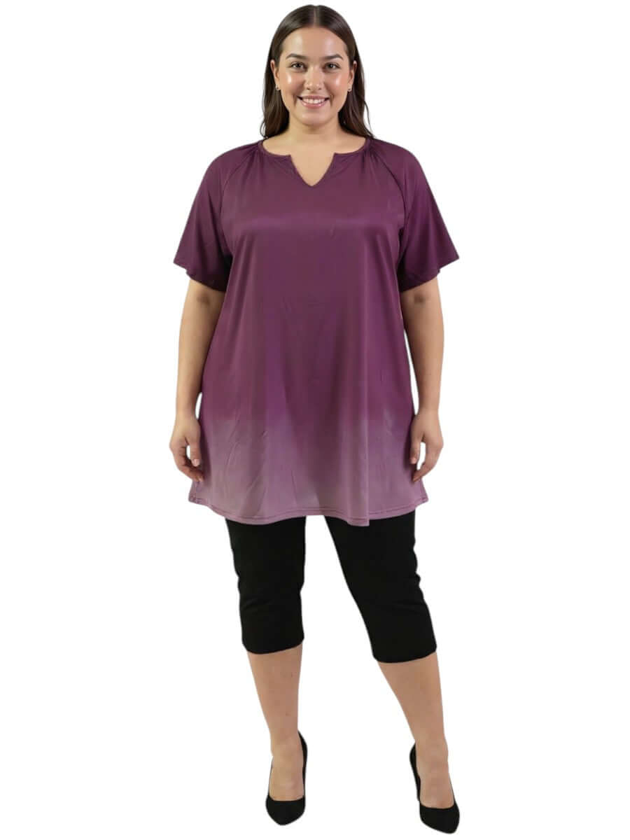Icelynn Tunic - Plum Ombre worn by a plus size model, showcasing a gradient design from deep plum to dusty lilac.