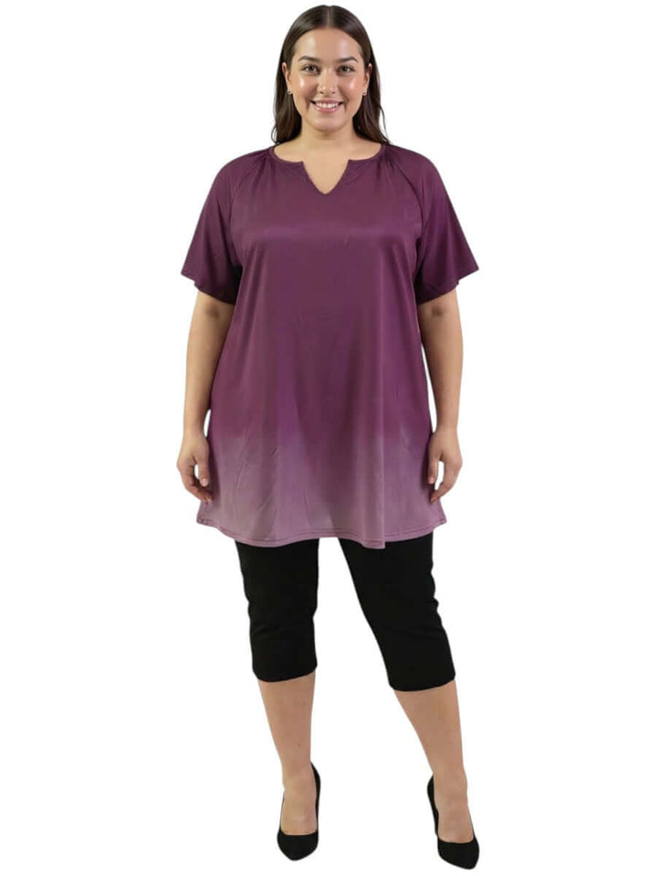 Icelynn Tunic - Plum Ombre worn by a plus size model, showcasing a gradient design from deep plum to dusty lilac.
