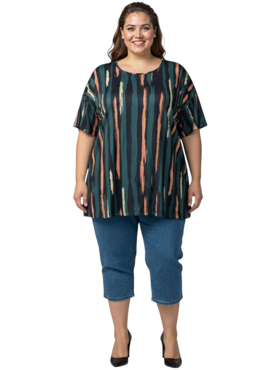 Velma Top - Green Print worn by a plus-size woman, featuring bold stripes in forest green, peach, and navy.