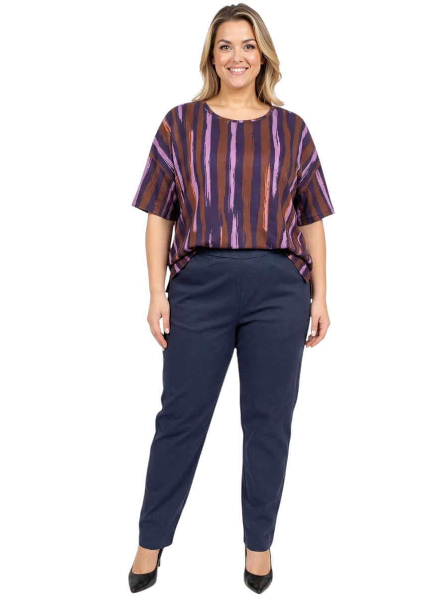 Velma Top - Purple Print worn by model, showcasing women's plus size fashion in stylish relaxed fit.