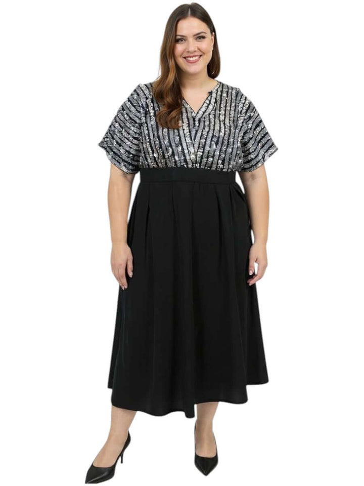 Plus Size Midnight Sonata Dress by Dale and Waters, black with sequin bodice and soft dolman sleeves, perfect for evening events.