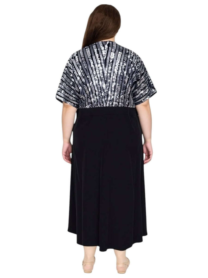 Back view of Plus Size Midnight Sonata Dress – Black by Dale and Waters, featuring a sequin-embellished bodice and flowing black skirt.