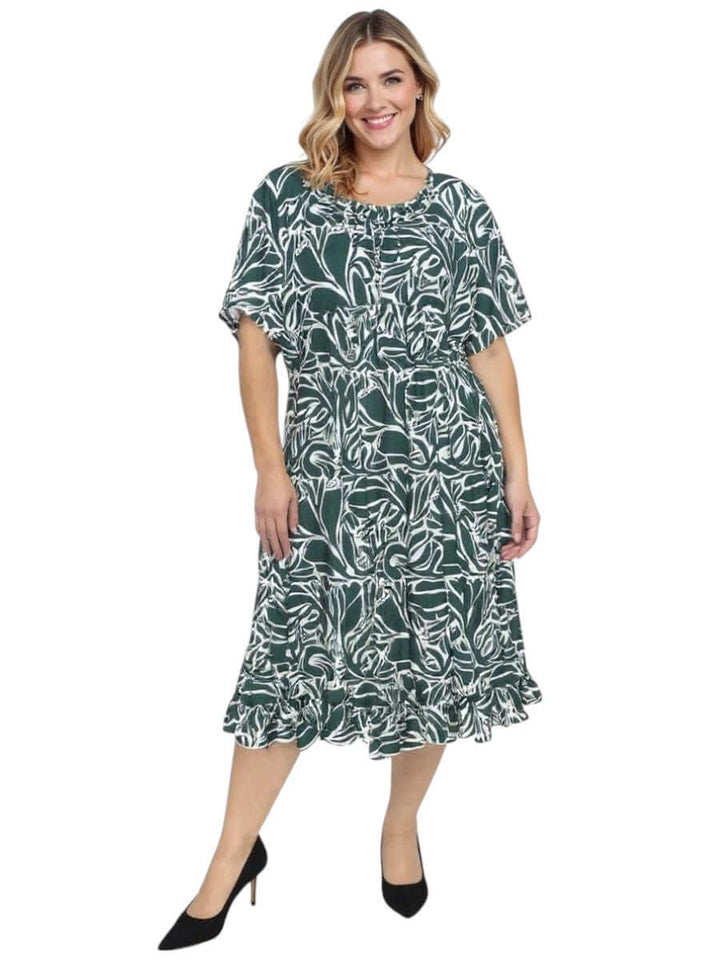 Women’s Plus Size Trinity Dress in green print with ruffled hem and short sleeves by Dale and Waters.