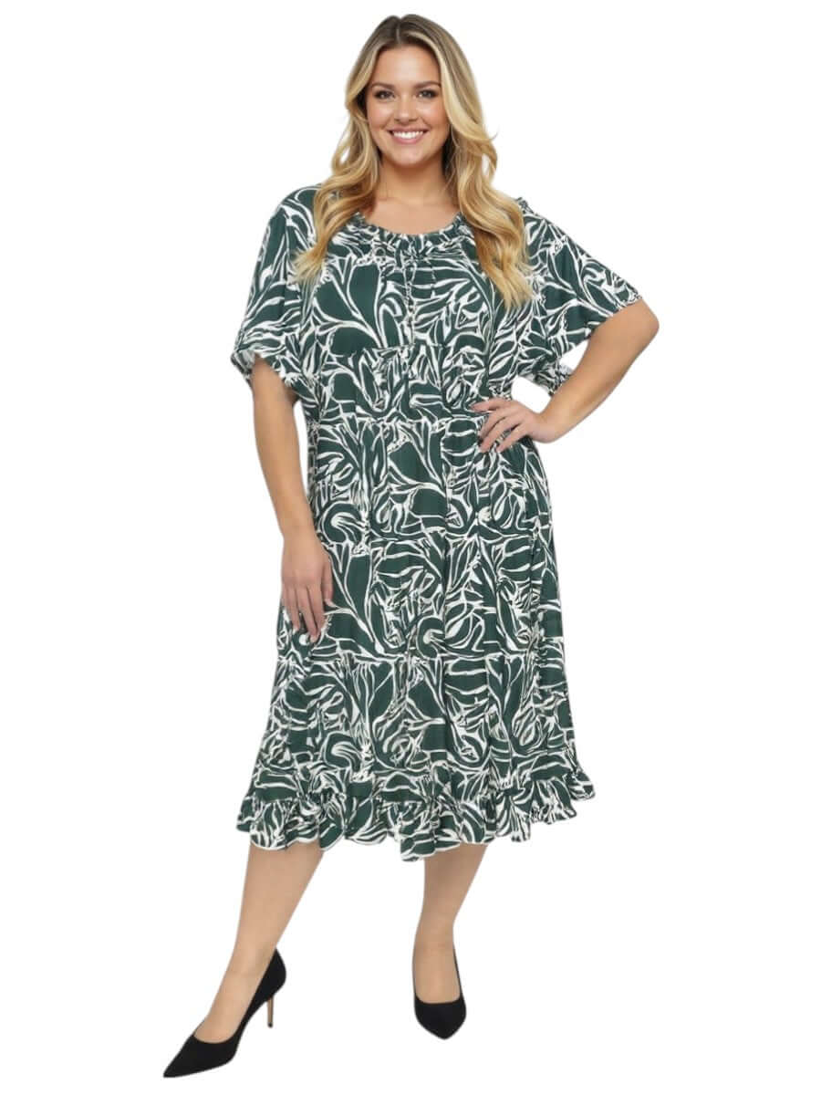 Women’s Plus Size Trinity Dress – Green Print by Dale and Waters, featuring a green and white floral design with pleated ruffle details.