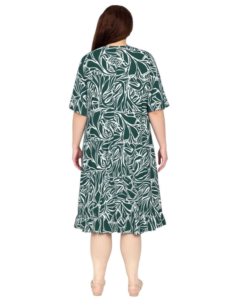 Back view of Dale and Waters Women’s Plus Size Trinity Dress in green print with ruffled hem and short raglan sleeves.