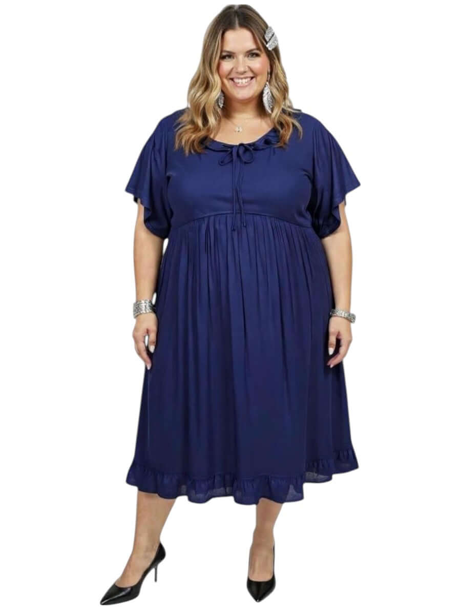 Women’s Plus Size Trinity Dress – Navy by Dale and Waters, featuring a ruffled neckline and babydoll silhouette.