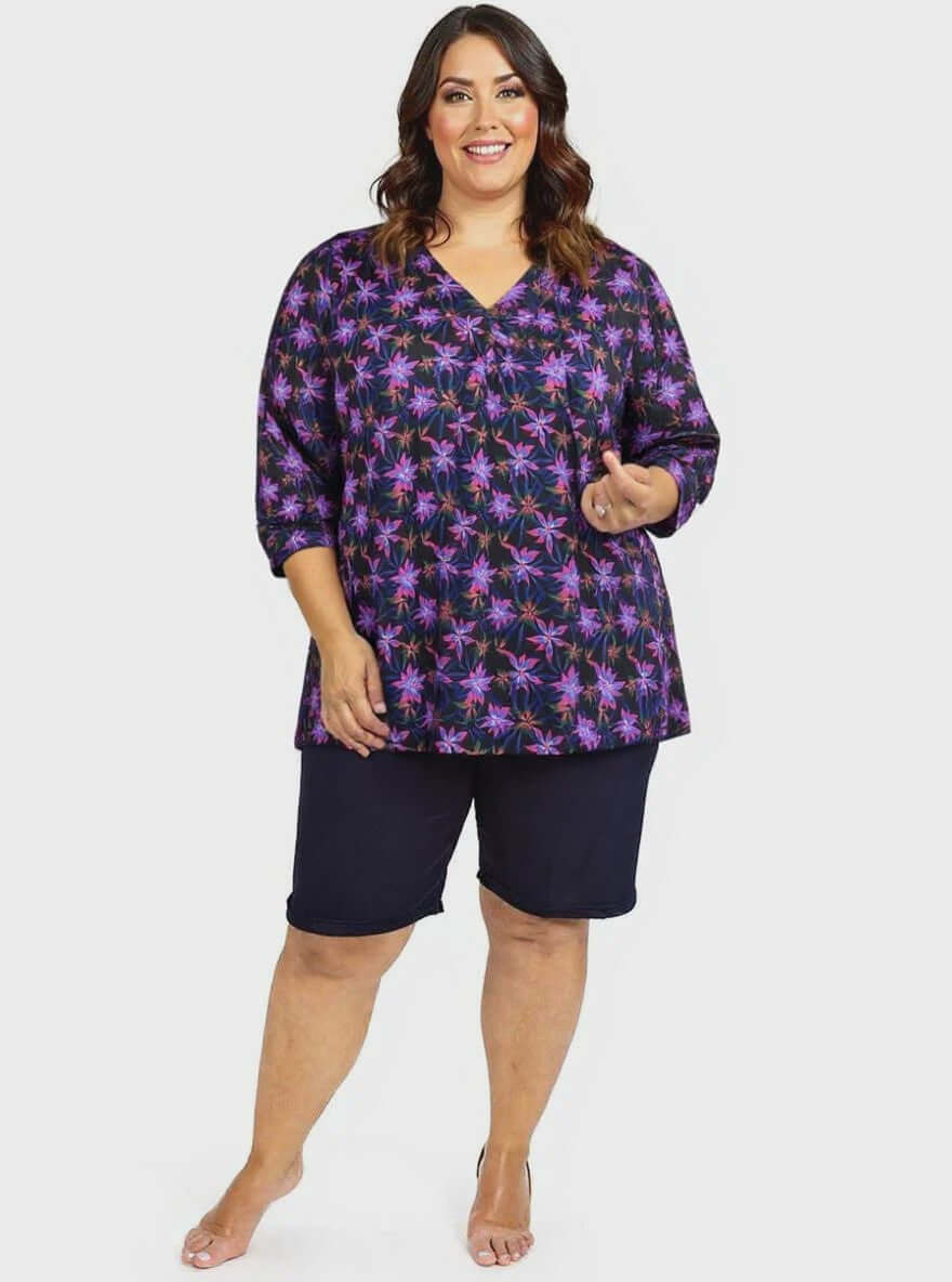 Moonlit Flora Swim Rashi - Black Print on a plus size woman, size 16-50, featuring a flattering fit and vibrant floral design.