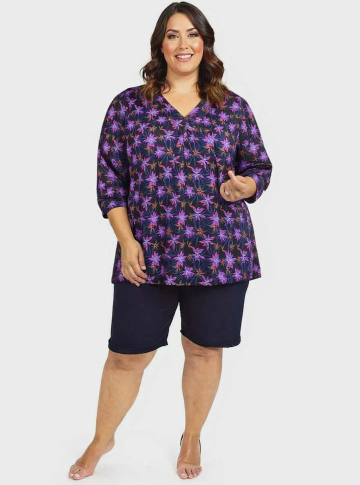 Moonlit Flora Swim Rashi - Black Print on a plus size woman, size 16-50, featuring a flattering fit and vibrant floral design.