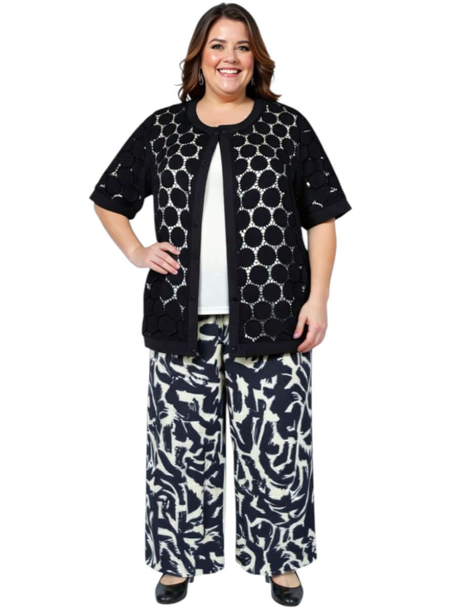 Plus-size woman wearing a Lasalle Jacket - Black with wide-leg pants, showcasing a chic, lightweight summer look.
