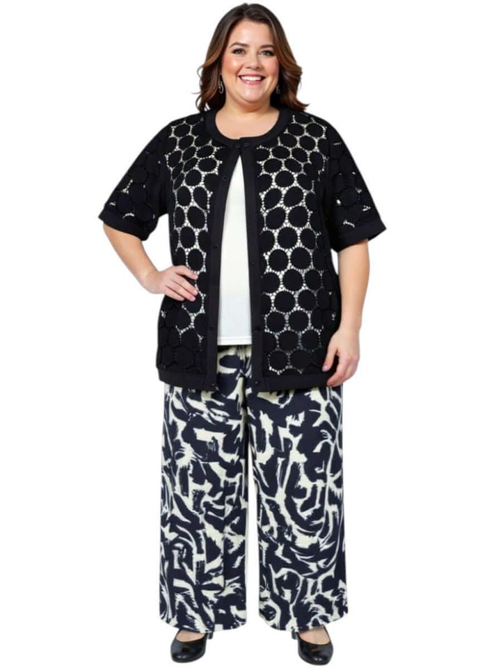 Plus-size woman wearing a Lasalle Jacket - Black with wide-leg pants, showcasing a chic, lightweight summer look.
