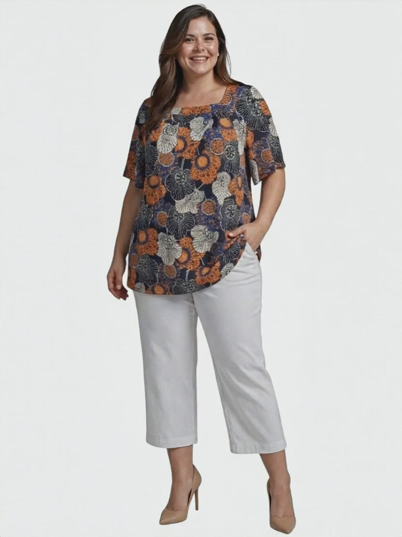 Lora Top - Navy Print worn by a model, showcasing its floral design and relaxed silhouette, plus size women's fashion.