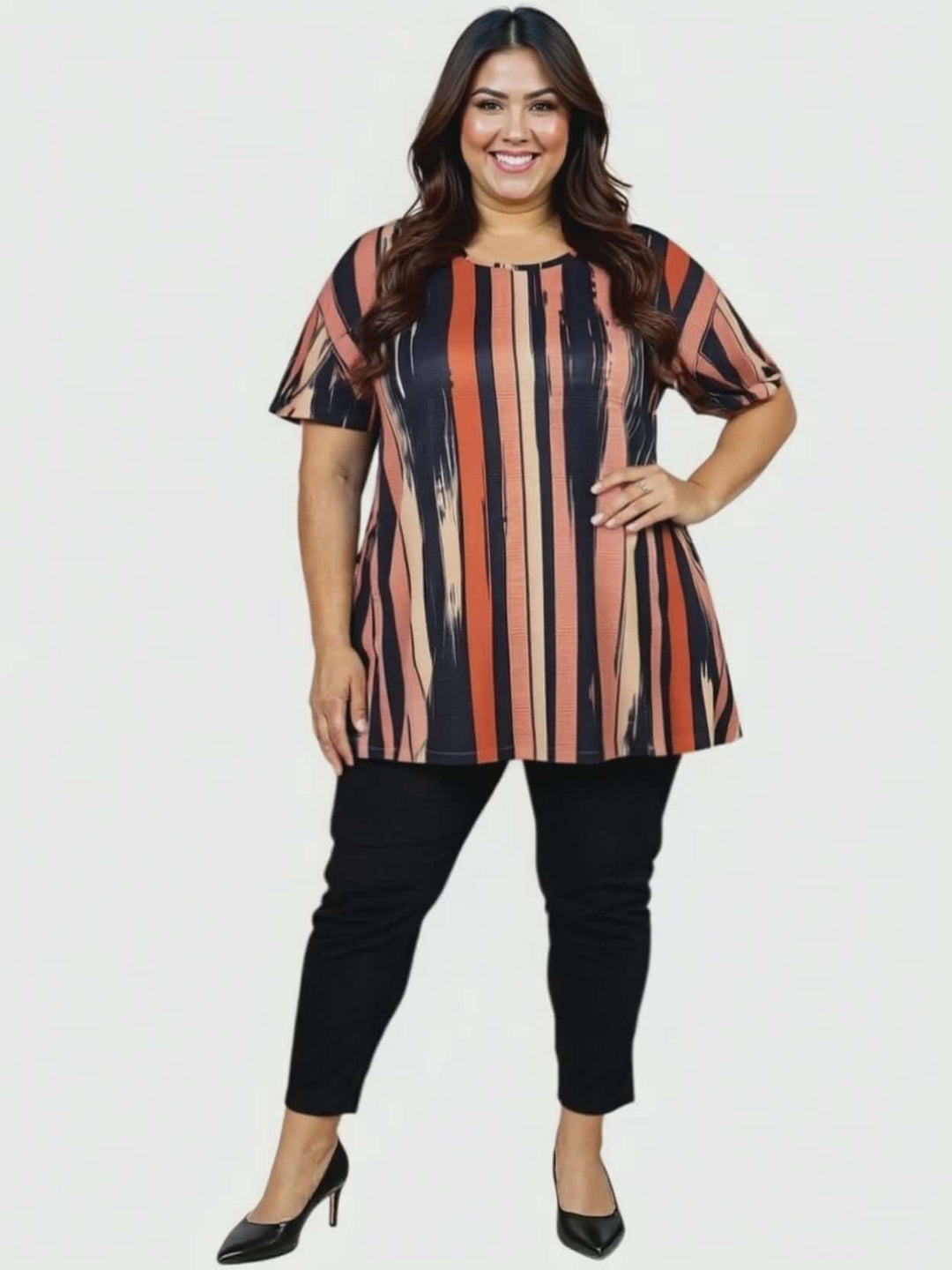 Women’s Plus Size Velma Top - Multi Print styled with black pants, showcasing vertical stripes and a flattering A-line cut.