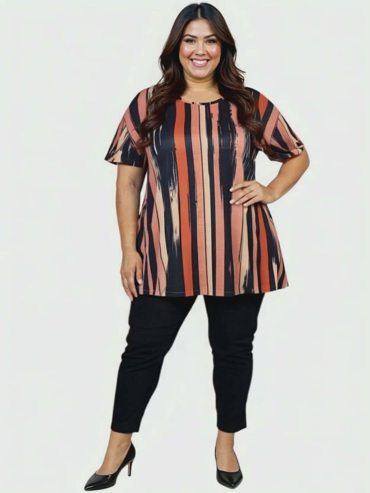 Women’s Plus Size Velma Top - Multi Print styled with black pants, showcasing vertical stripes and a flattering A-line cut.