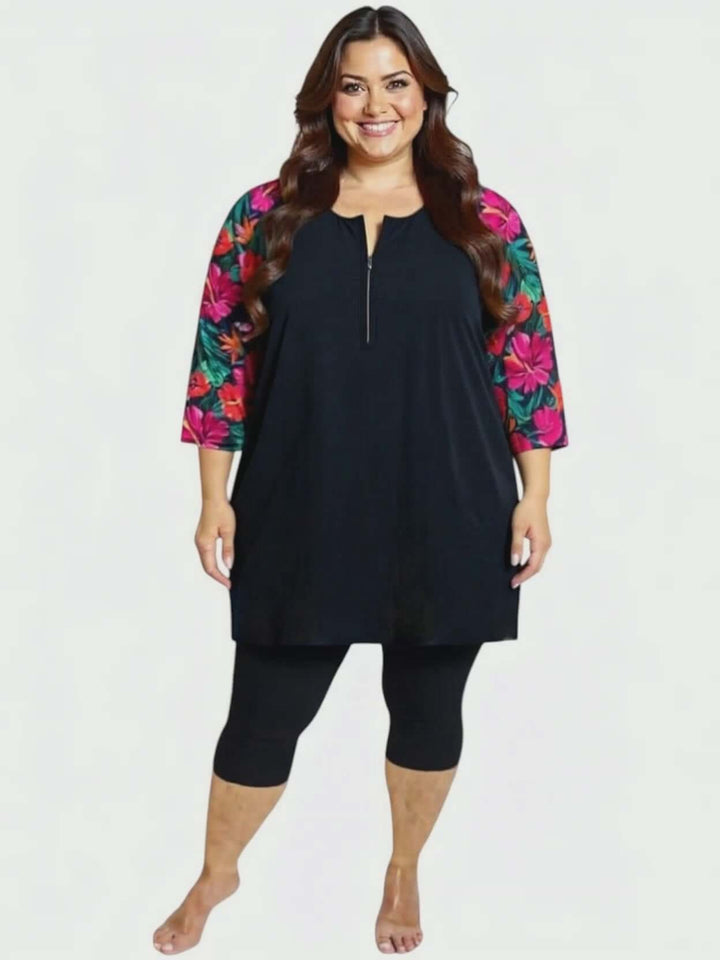 Hibiscus Bloom Tunic Swim Rashi - Black Print for plus size women, sizes 16-50, by Dale & Waters, featuring vibrant floral sleeves.