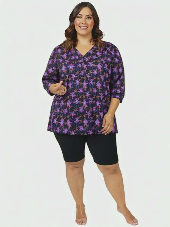 Plus size women’s Moonlit Flora Swim Rashi - Black Print top, featuring a vibrant floral design and flattering fit.