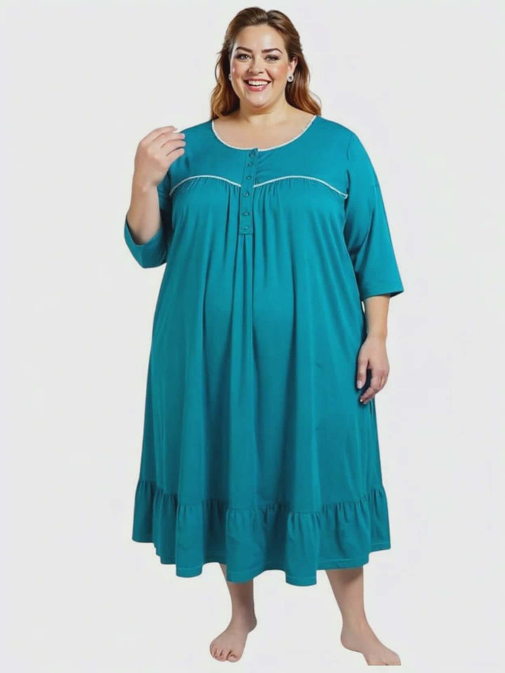 Paxton Nightie - Teal worn by a plus-size woman, featuring elegant design and frill hem for comfort and style.