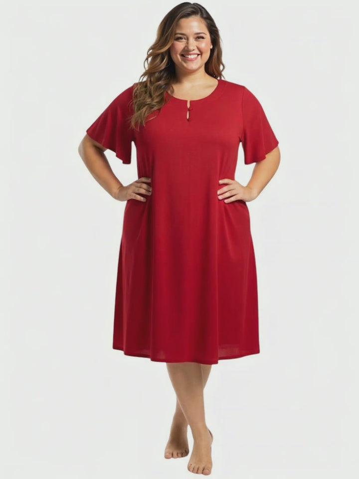 Noeleen Nightie - Red plus size women's night dress from Dale and Waters, size 16-50, featuring flutter sleeves and pockets.
