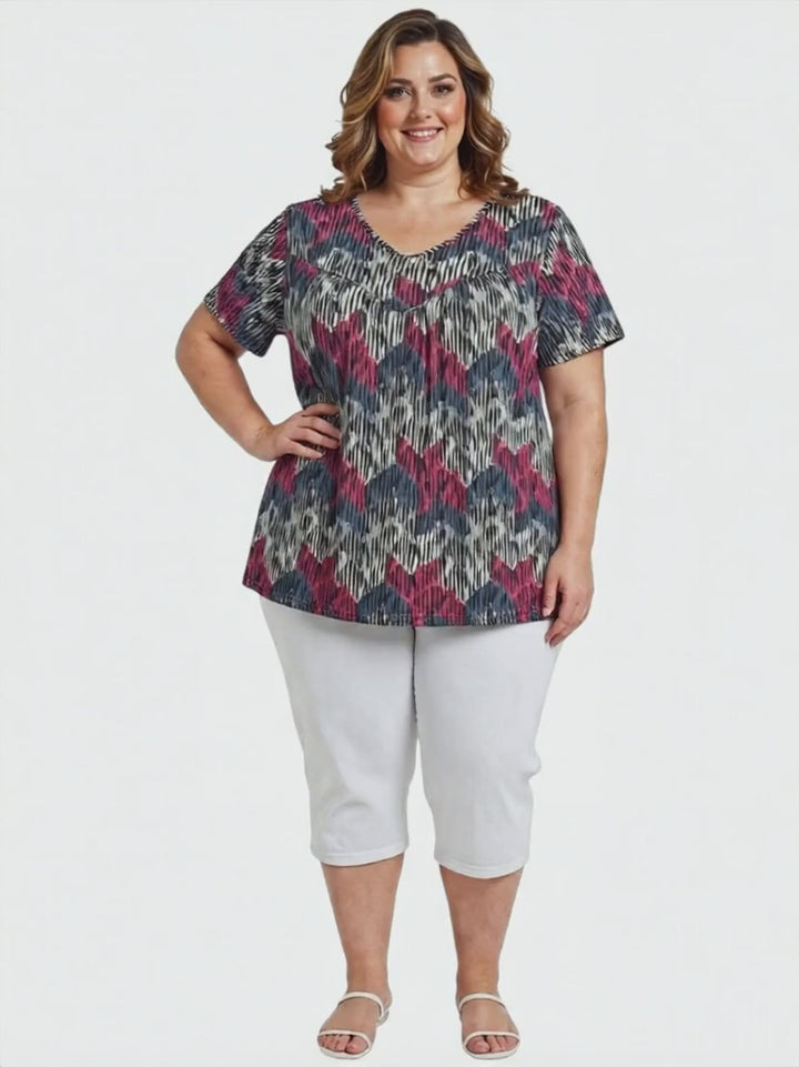 Women in plus size Fernando Top - Plum Print featuring vibrant abstract chevron pattern, stylish and comfortable.