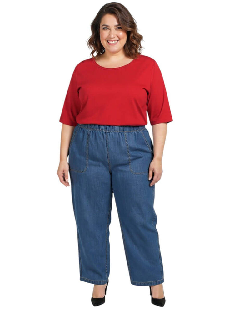 Women wearing Everyday Tee - Red - Cotton Spandex with plus size jeans, shown in a casual style and comfortable fit.